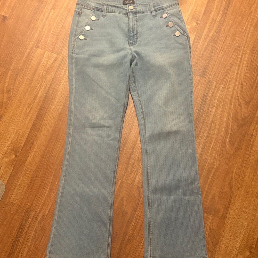 Closure: Zip fly with button closure, 5-pocket styling